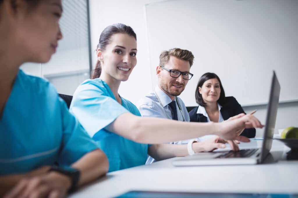 doctors-discussing-laptop-meeting-1024x683