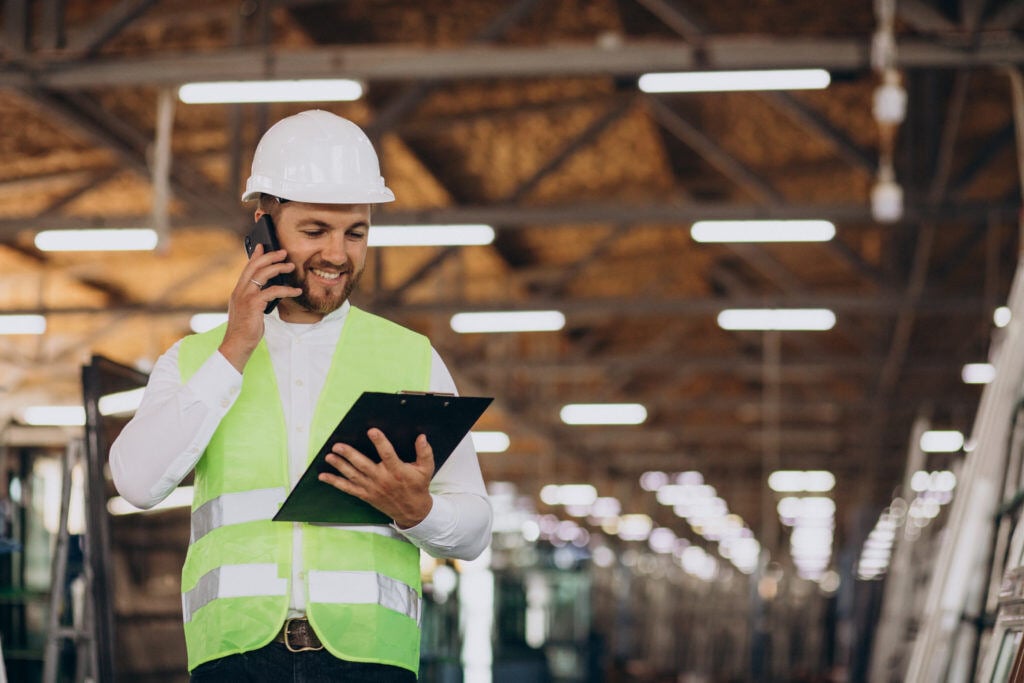 young-man-engineer-working-factory-making-order-phone-1024x683